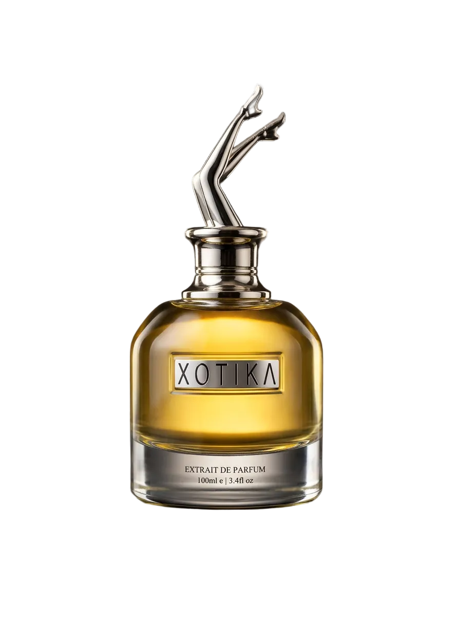 NOIR perfume bottle with artistic cap on a reflective surface