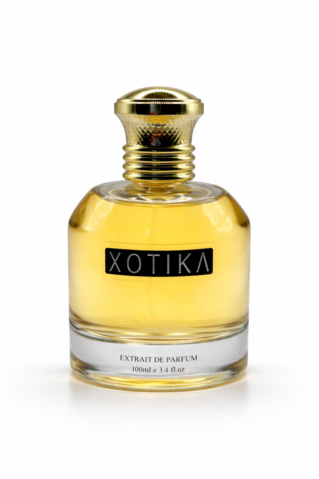 Xotika perfume bottle with gold cap on a white background