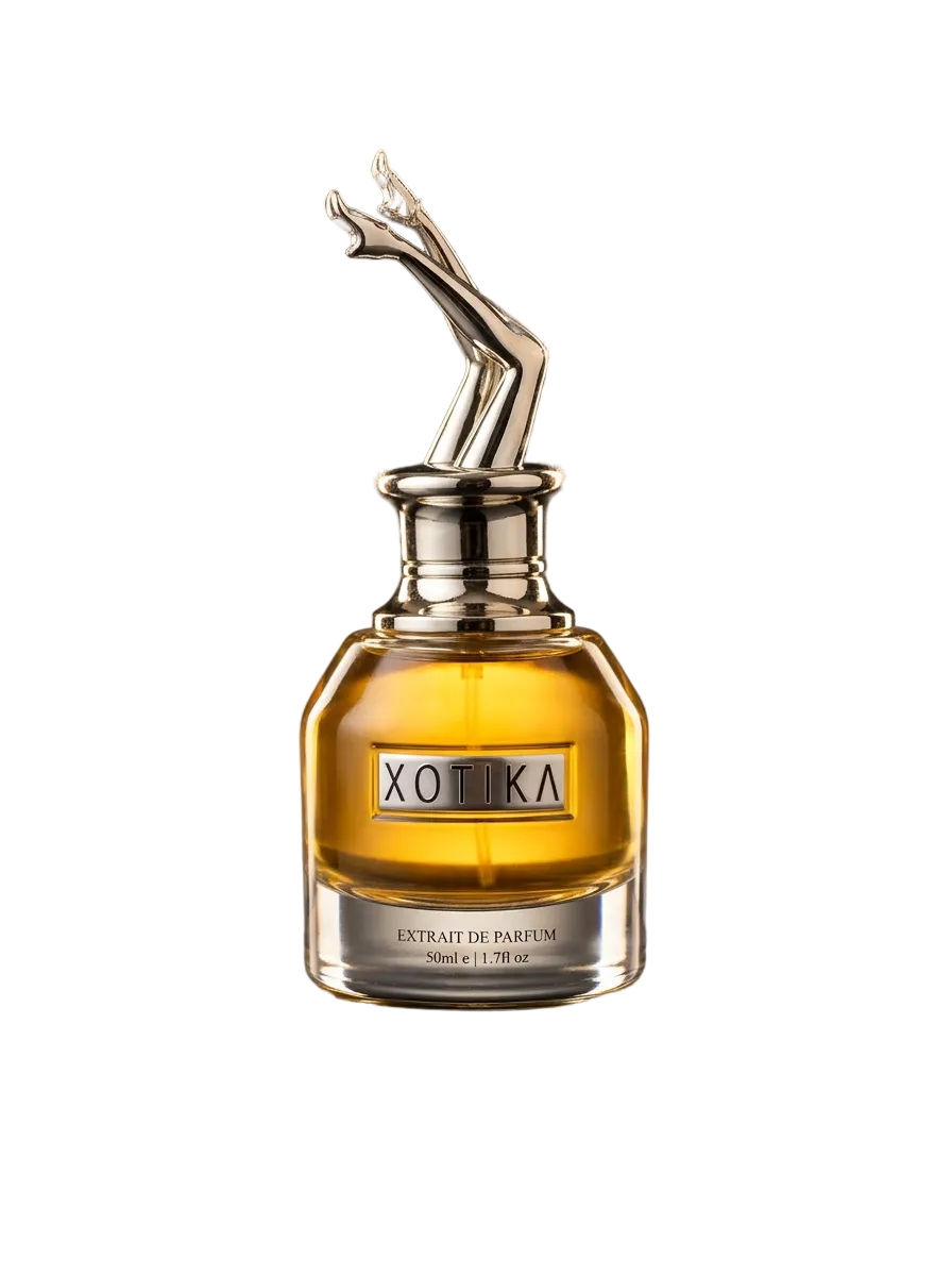 Perfume bottle with gold cap on a reflective surface
